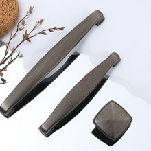 Load image into Gallery viewer, Close-up of Brushed Black Nickel Finish on Cabinet Pulls