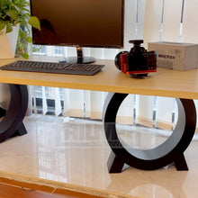 Load image into Gallery viewer, Desk with Triumph Hardware matte black metal chair legs supporting a wooden tabletop, heavy-duty steel construction for stability.