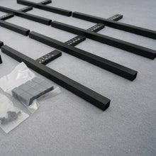 Load image into Gallery viewer, Components of 2-tier adjustable plant stand with detachable design, showing black metal frames and assembly kit on a grey background.