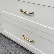 Load image into Gallery viewer, Installed Gold Dresser Pulls and Knobs on a Bedroom Dresser