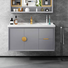 Load image into Gallery viewer, Modern bathroom vanity with gray cabinets, brass accents, and a white countertop, topped with stylish decor.
