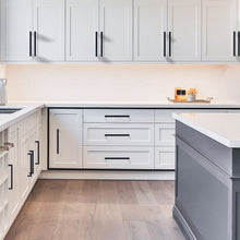 Load image into Gallery viewer, Modern kitchen with matte black cabinet handles showcasing Triumph Hardware's durable square cabinet pulls.