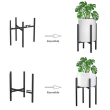 Load image into Gallery viewer, Adjustable metal plant stand in matte black, tool-free assembly, reversible design, shown with potted plant for indoor and outdoor use.