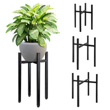 Load image into Gallery viewer, Adjustable matte black metal plant stand holding a potted plant, showcasing reversible design and tool-free assembly features, 2-pack included.
