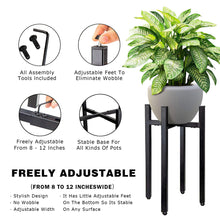 Load image into Gallery viewer, Adjustable metal plant stand in matte black holding a potted plant, showcasing reversible design and tool-free assembly features.