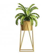 Load image into Gallery viewer, Gold metal flower pot rack with lush green plant, ideal for indoor and outdoor decor, by Triumph Hardware.