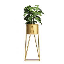 Load image into Gallery viewer, Golden metal plant pot rack with a green plant, ideal for indoor and outdoor use, perfect for home decoration from Triumph Hardware.