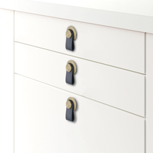 Загрузить изображение в средство просмотра галереи, Cabinet with black leather knobs featuring brushed brass and zinc alloy accents, modern European design by Triumph Hardware.