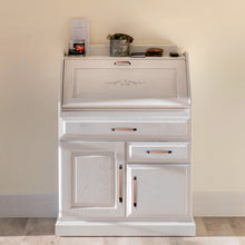 Загрузить изображение в средство просмотра галереи, White cabinet with Triumph Hardware antique copper handles, featuring multiple drawers and compartments against a neutral wall.