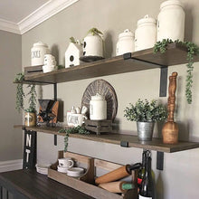 Load image into Gallery viewer, Rustic kitchen with Midofar black iron shelf brackets supporting farmhouse decor and plants on wooden open shelves.