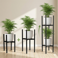 A versatile 2-tier black metal plant stand shown in three different assembly configurations with potted green plants against a neutral wall.