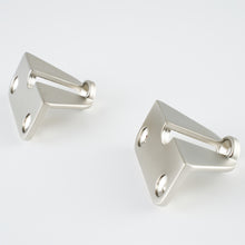 Load image into Gallery viewer, Front view of two Mist Silver brackets from the Internal Handle Adapter Set securing a black handle.
