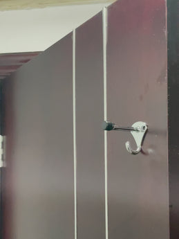Video demonstration of the zinc alloy door stop hook installed in a commercial gym or clothing store changing room.