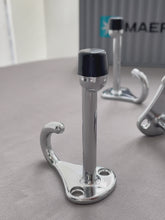Load and play video in Gallery viewer, Close-up video showcasing the mirror-like polished chrome finish of the solid zinc alloy door stopper

