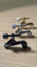 Load and play video in Gallery viewer, Professional 2-pack hinge pin door stop set in champagne bronze. Made of high-quality zinc alloy by Triumph Hardware. Features adjustable screw length to protect walls and doors from damage. Ideal for home remodeling and office interior hardware upgrades.
