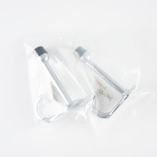 Load image into Gallery viewer, Packaging view showing the 2-pack polished chrome door stop hooks in clear protective bags.
