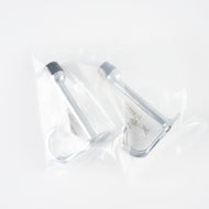 Packaging view showing the 2-pack polished chrome door stop hooks in clear protective bags.